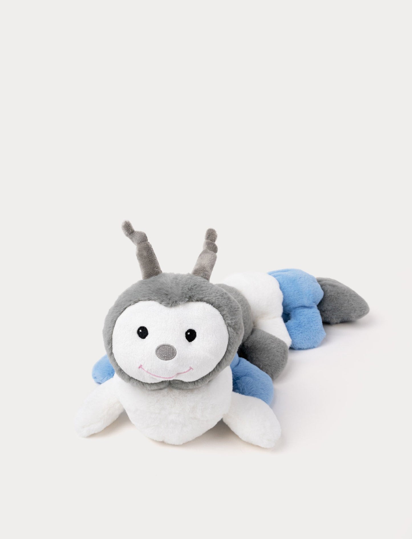 Plush caterpillar in light gray, soft blue, and white, with a round, segmented body and a gentle expression.