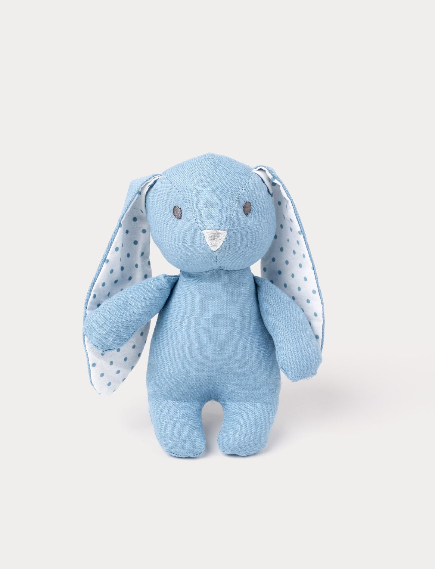 A bunny with sky blue cotton, large white ears with blue polka dots, and a silver nose.