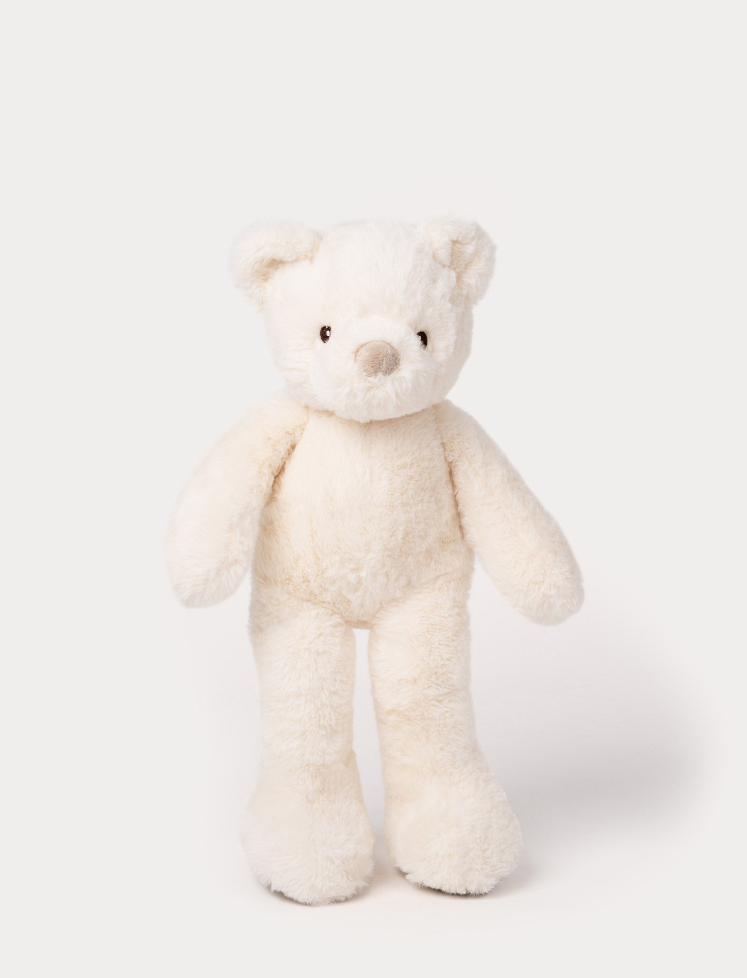  Image of White plush teddy bear with long legs, round ears, and a soft beige nose.