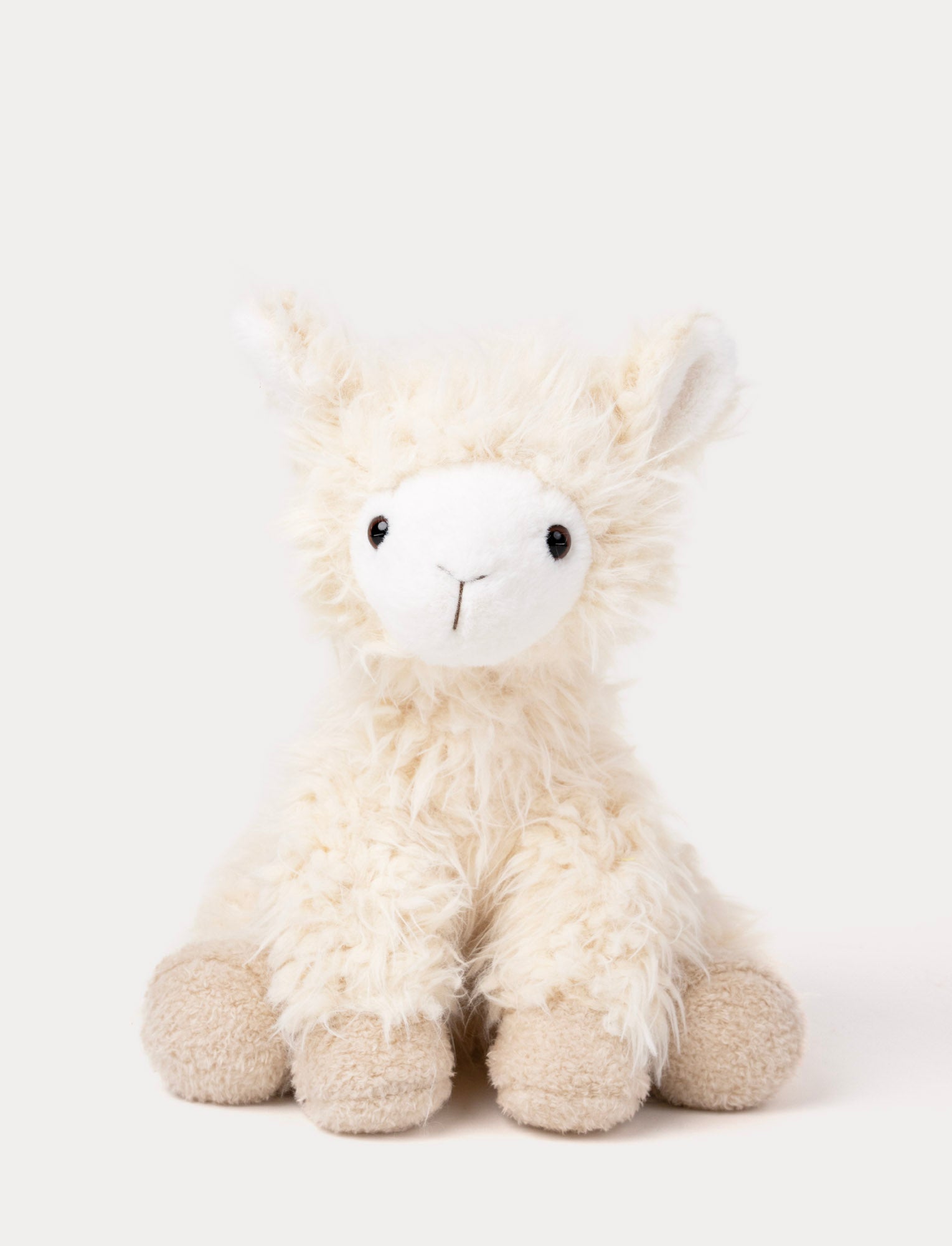  Image of Soft plush llama with fluffy cream-colored fur, a white face, black eyes, and beige hooves.
