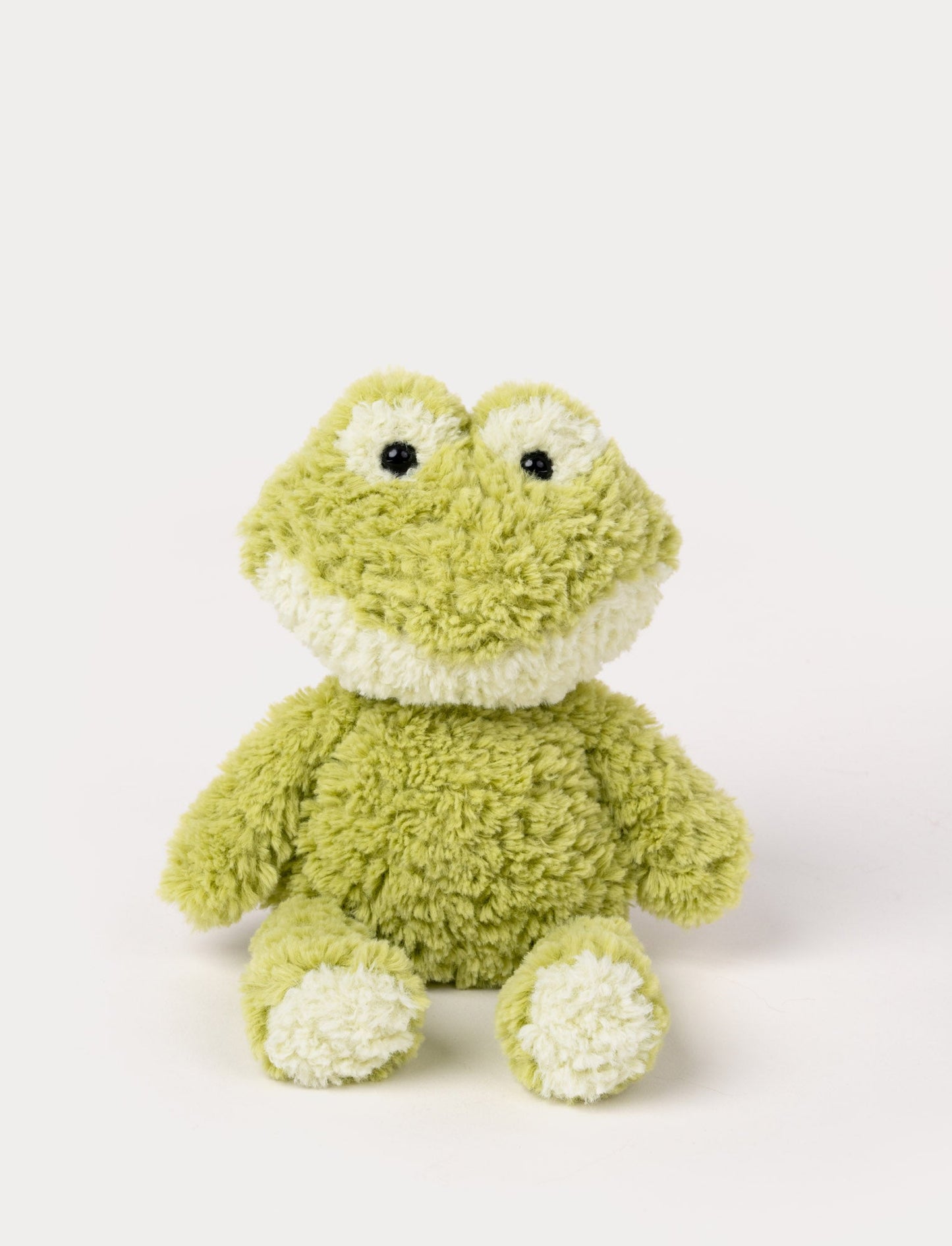 Soft plush frog in light green with a white details, featuring black shiny eyes.