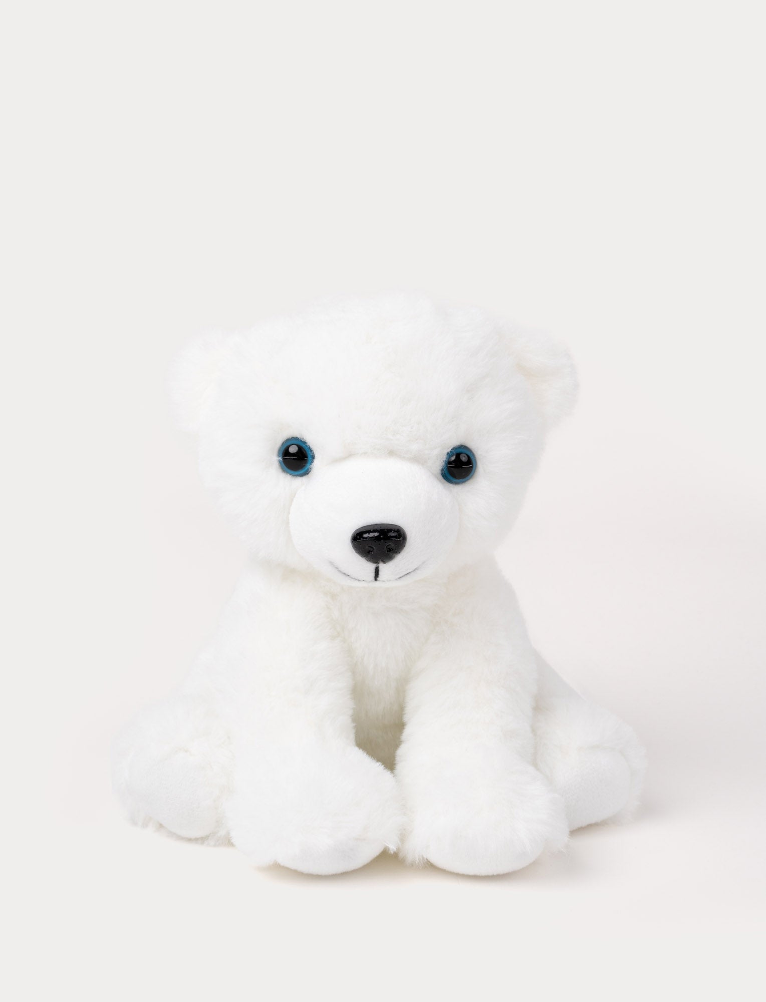  Image of A polar bear with white fur and gentle blue eyes, perfect for cuddles and play.