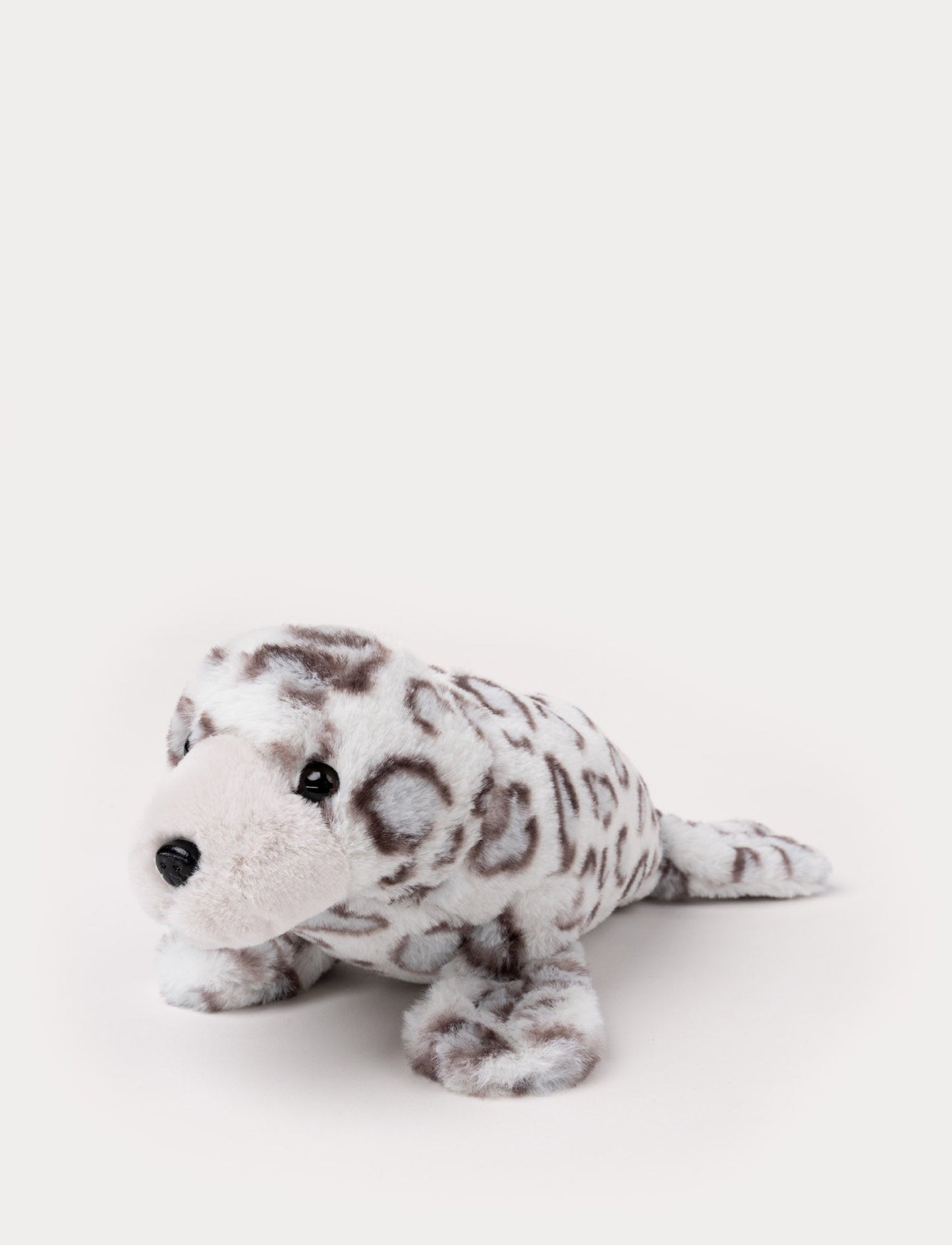 Plush seal with a soft white and gray spotted pattern, black eyes, and a gentle expression.
