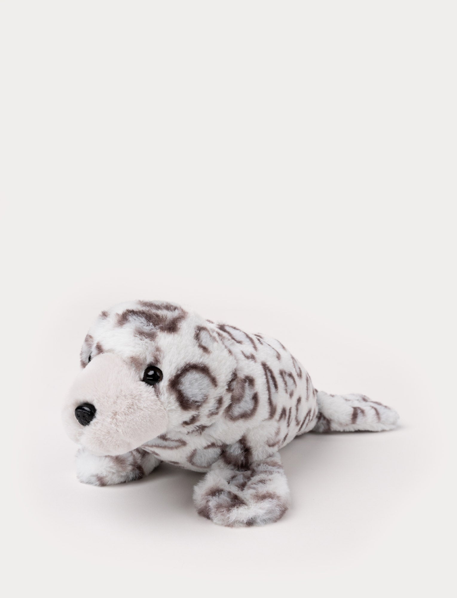  Image of Plush seal with a soft white and gray spotted pattern, black eyes, and a gentle expression.