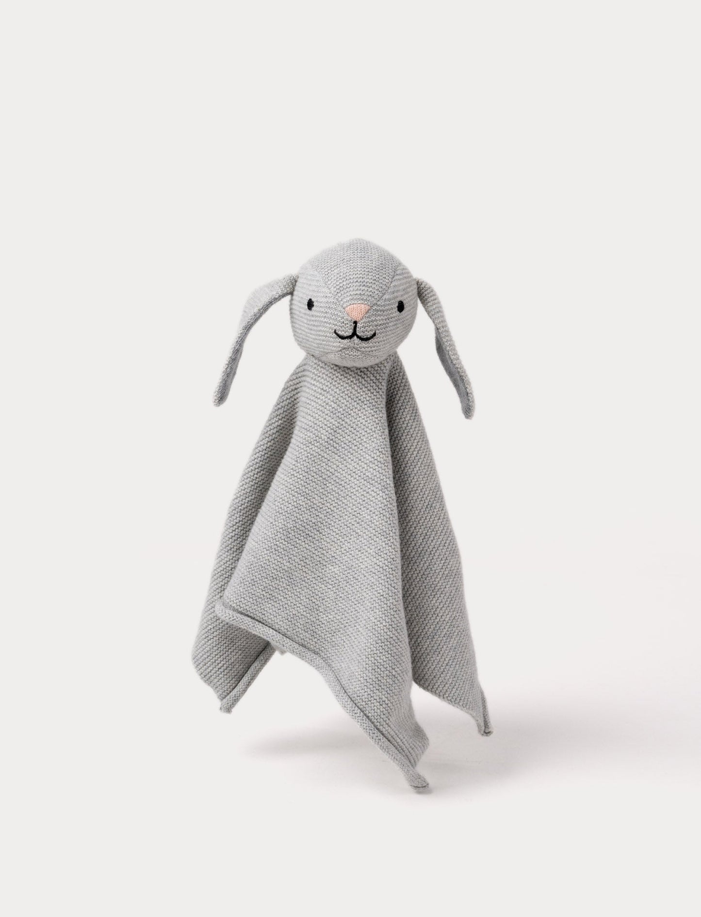 A knitted grey bunny comforter with floppy ears, a stitched face, and a soft textured fabric.