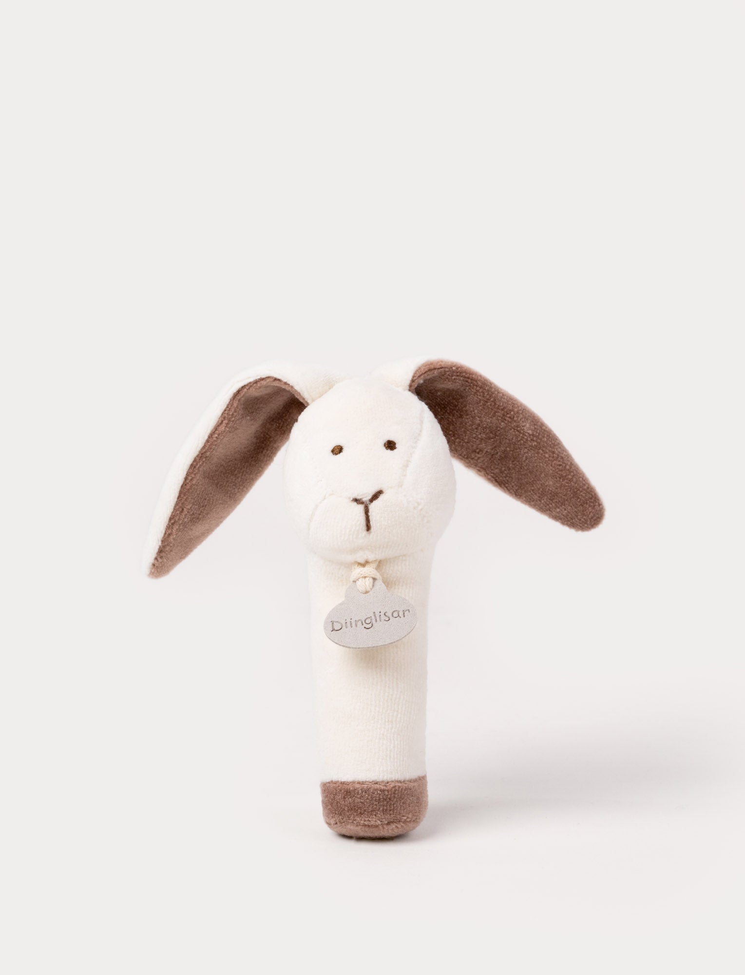  Image of A plush bunny rattle with a soft white body, brown floppy ears, and a stitched face