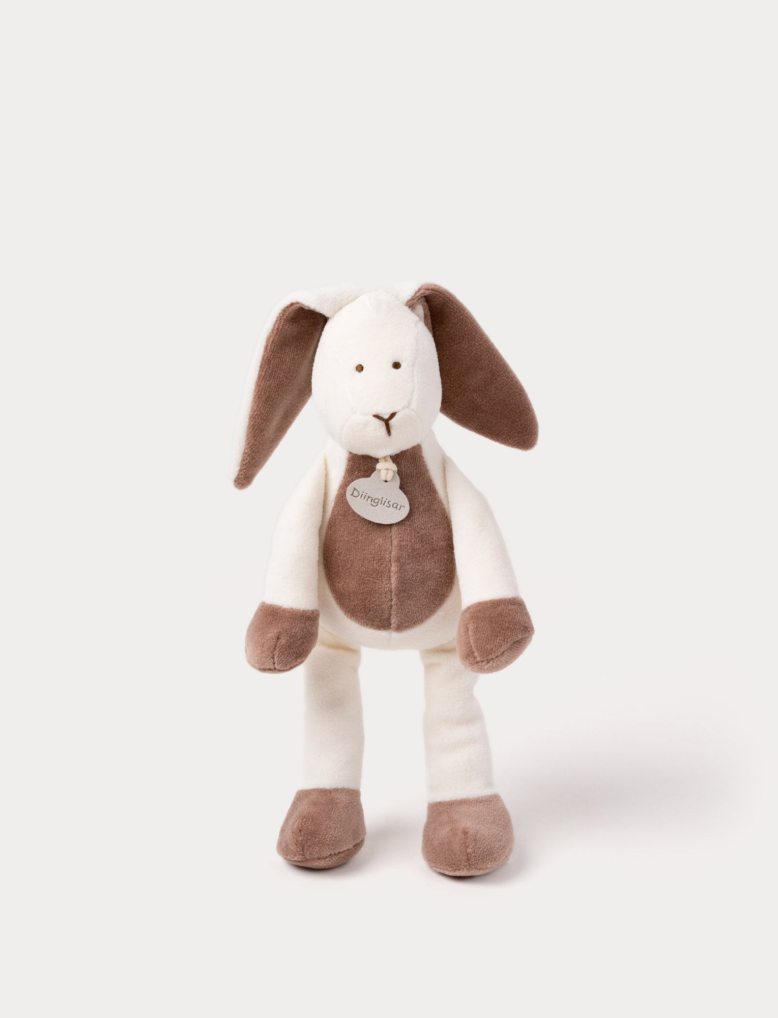  Image of A soft plush beige bunny  with broaded eyes and nose, white, and brown details.