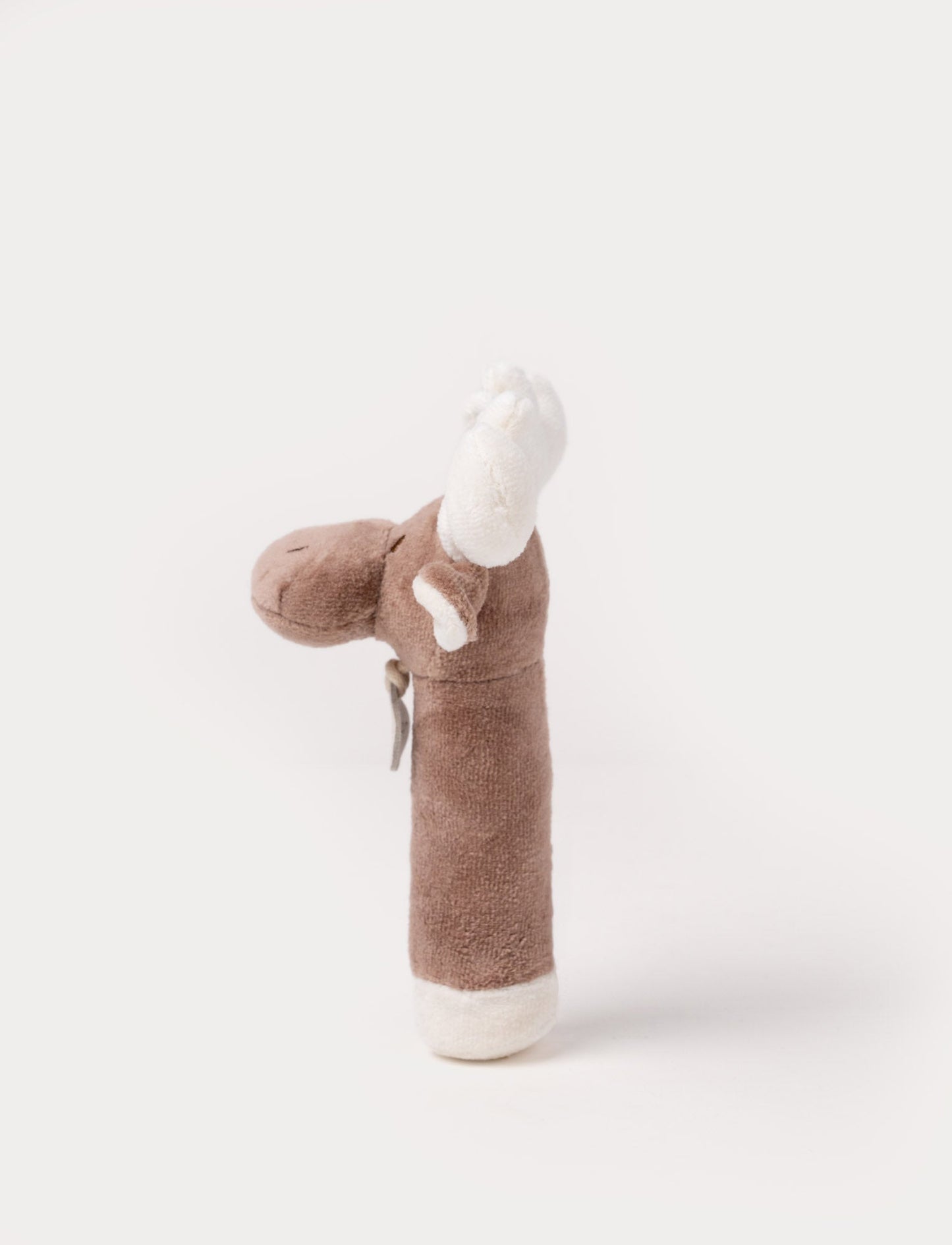 A plush moose rattle with a soft brown body, white antlers, and a stitched face