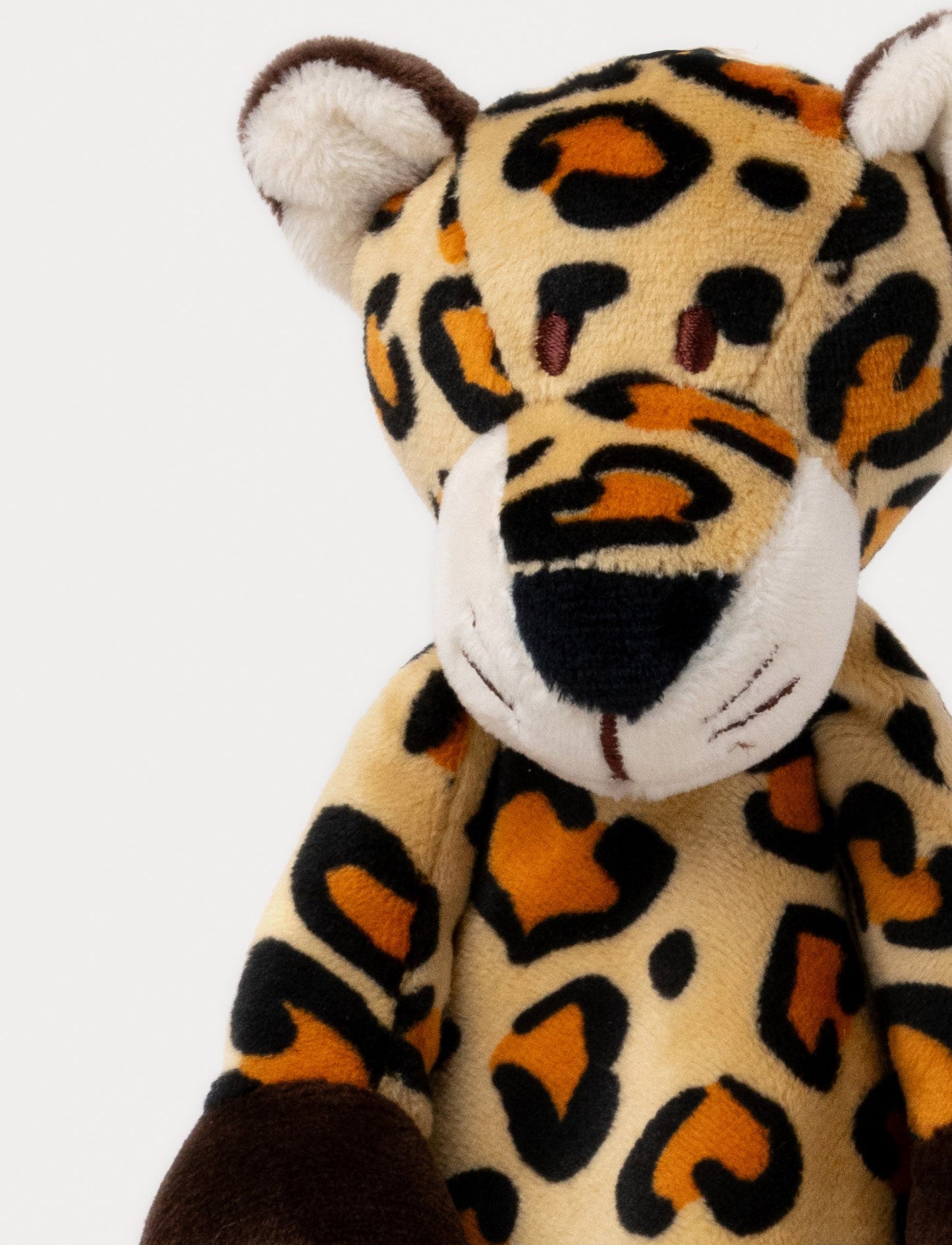 Soft baby blanket with a plush leopard head, spotted pattern, and dark brown trim.