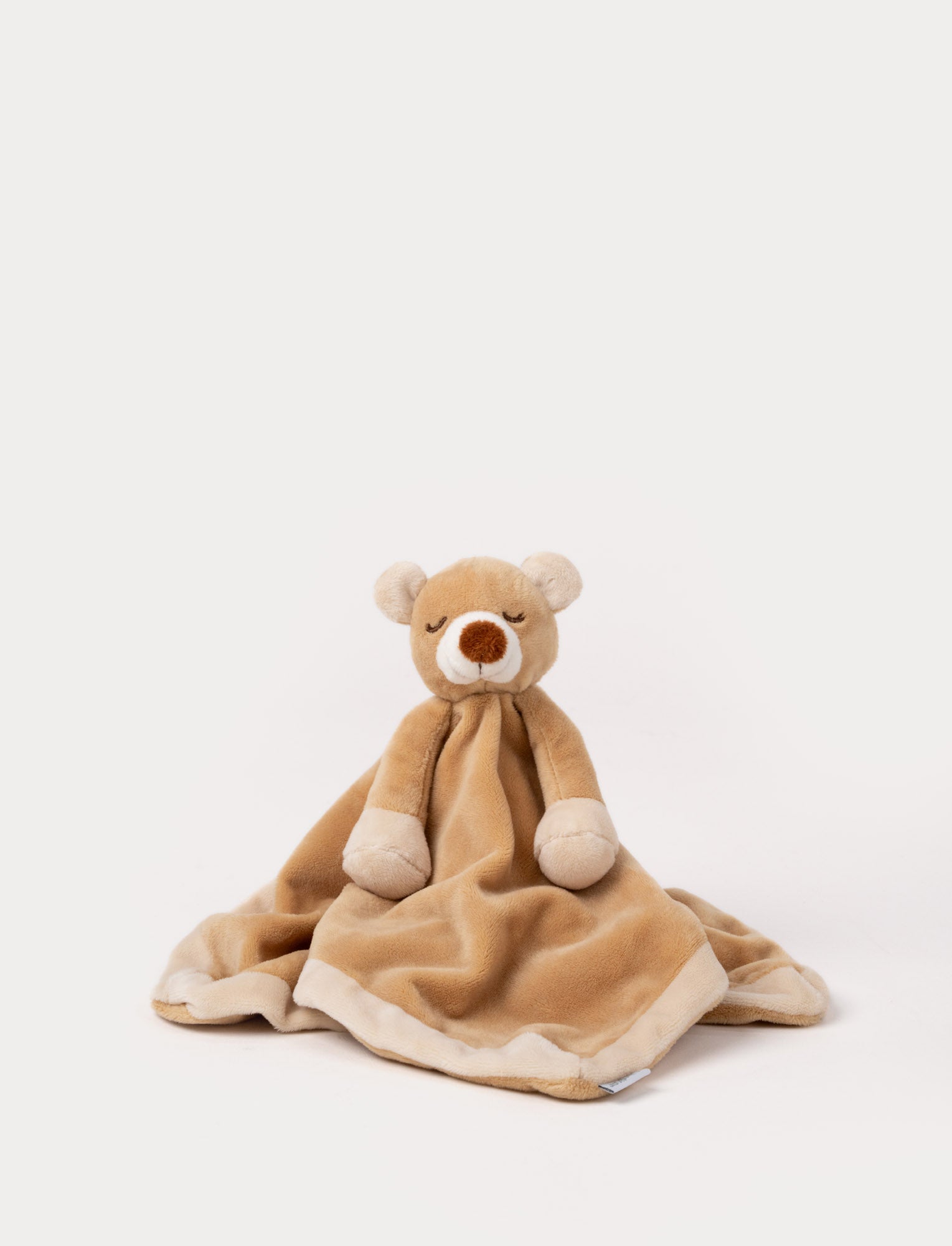 Image of Soft baby blanket with a plush brown bear head, closed eyes, and cream-trimmed edges.