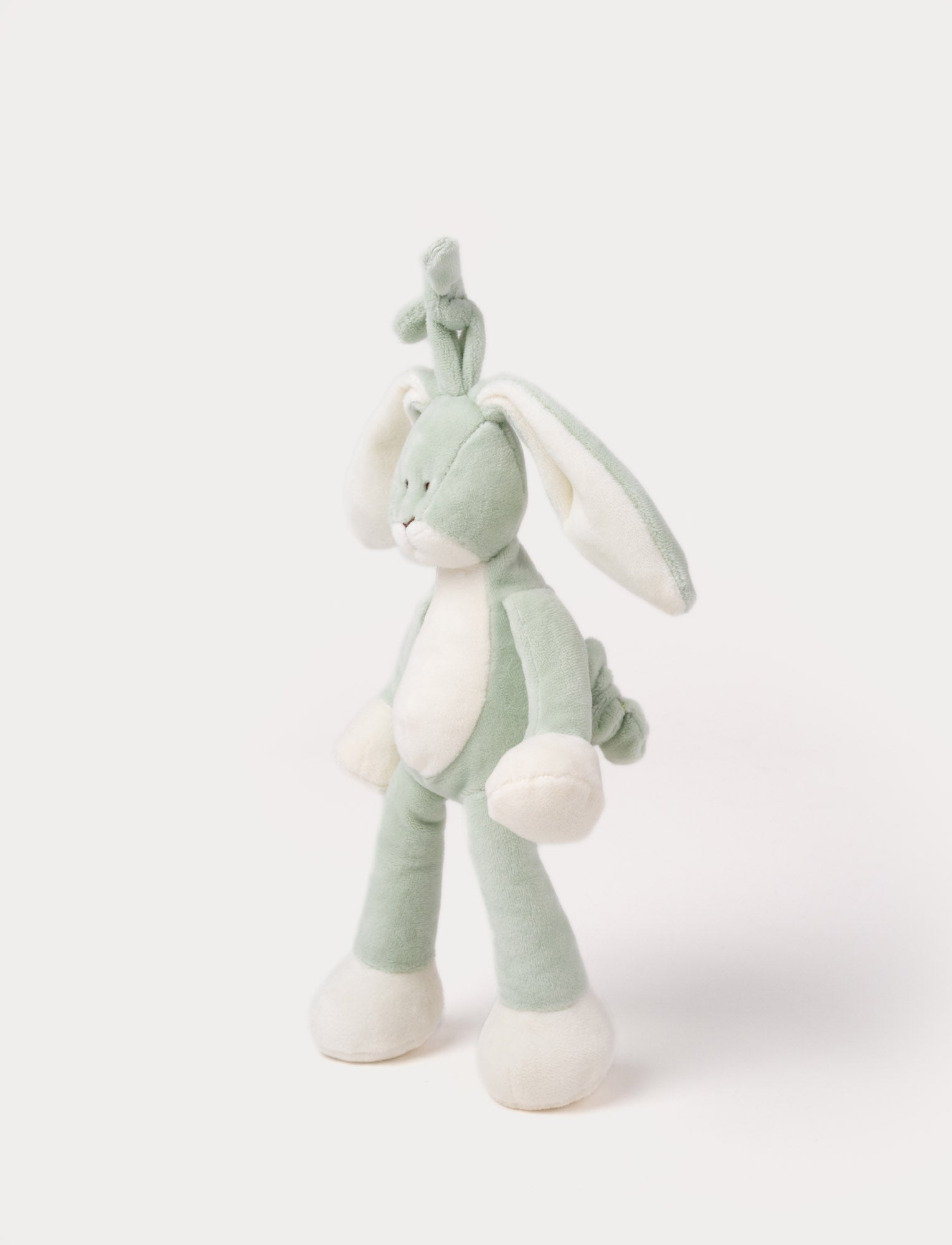  Image of A plush sage green bunny music box with long floppy ears, a white belly, and a hanging loop.