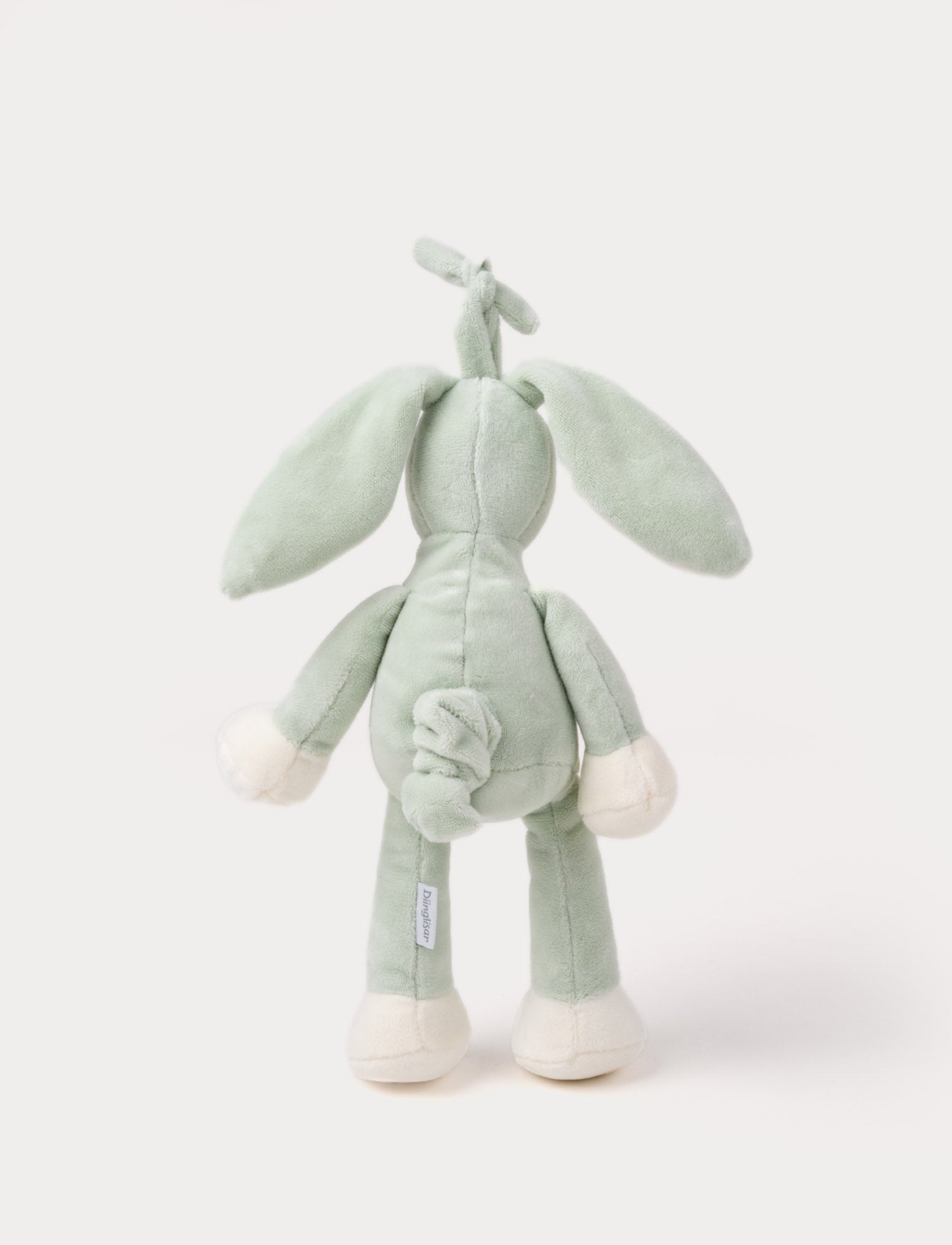  Image of A plush sage green bunny music box with long floppy ears, a white belly, and a hanging loop.