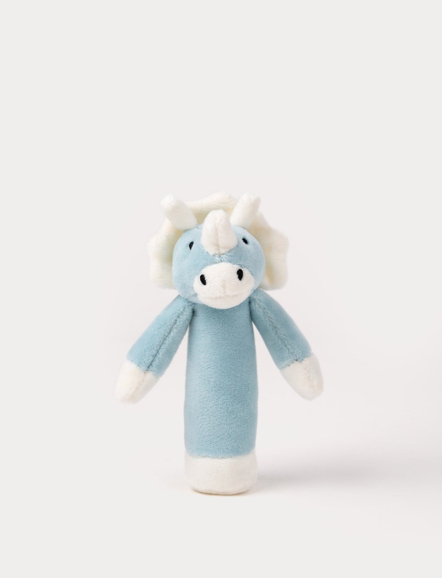 Soft plush triceratops rattle with a blue body, white horns, a frilled crest, and embroidered eyes.