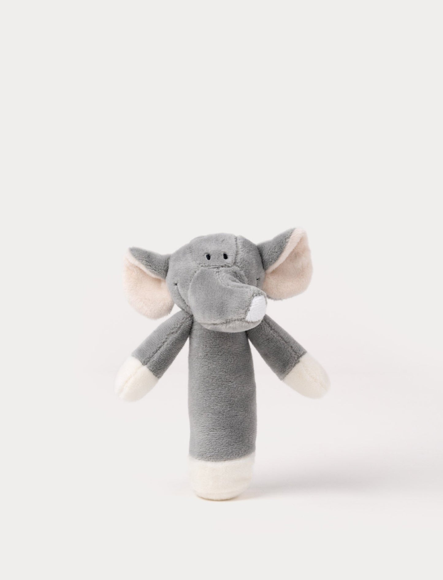Soft plush elephant rattle with a grey body, embroidered eyes, large floppy ears, and a long trunk.