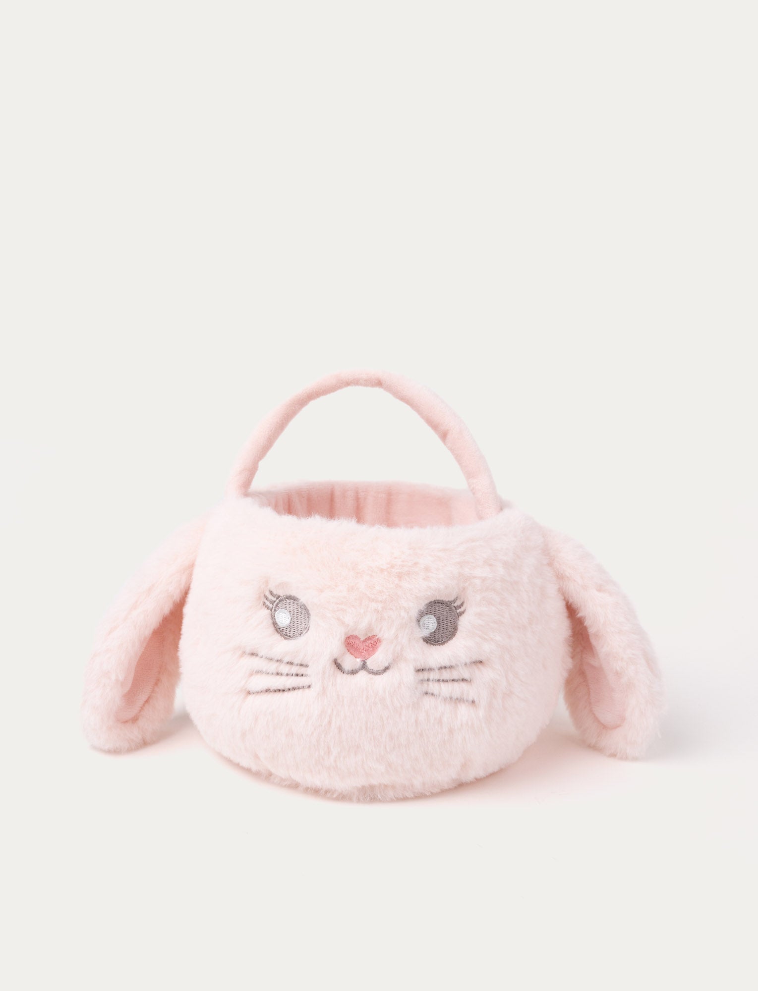  Image of A soft plush bunny basket with practical handles and cute pink fabric.