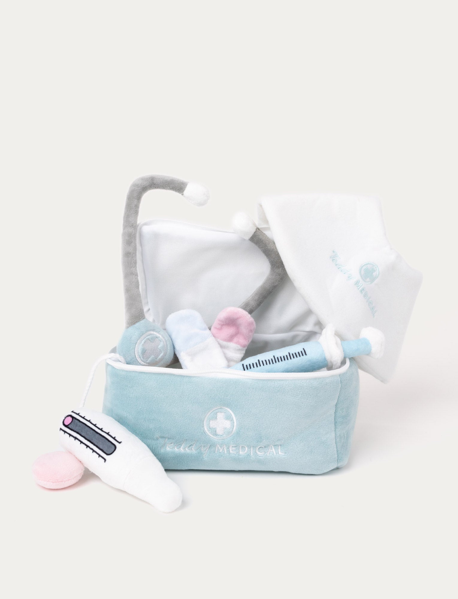  Image of A soft plush doctor’s kit with a stethoscope, thermometer, syringe, Velcro bandages, and an adjustable cone.