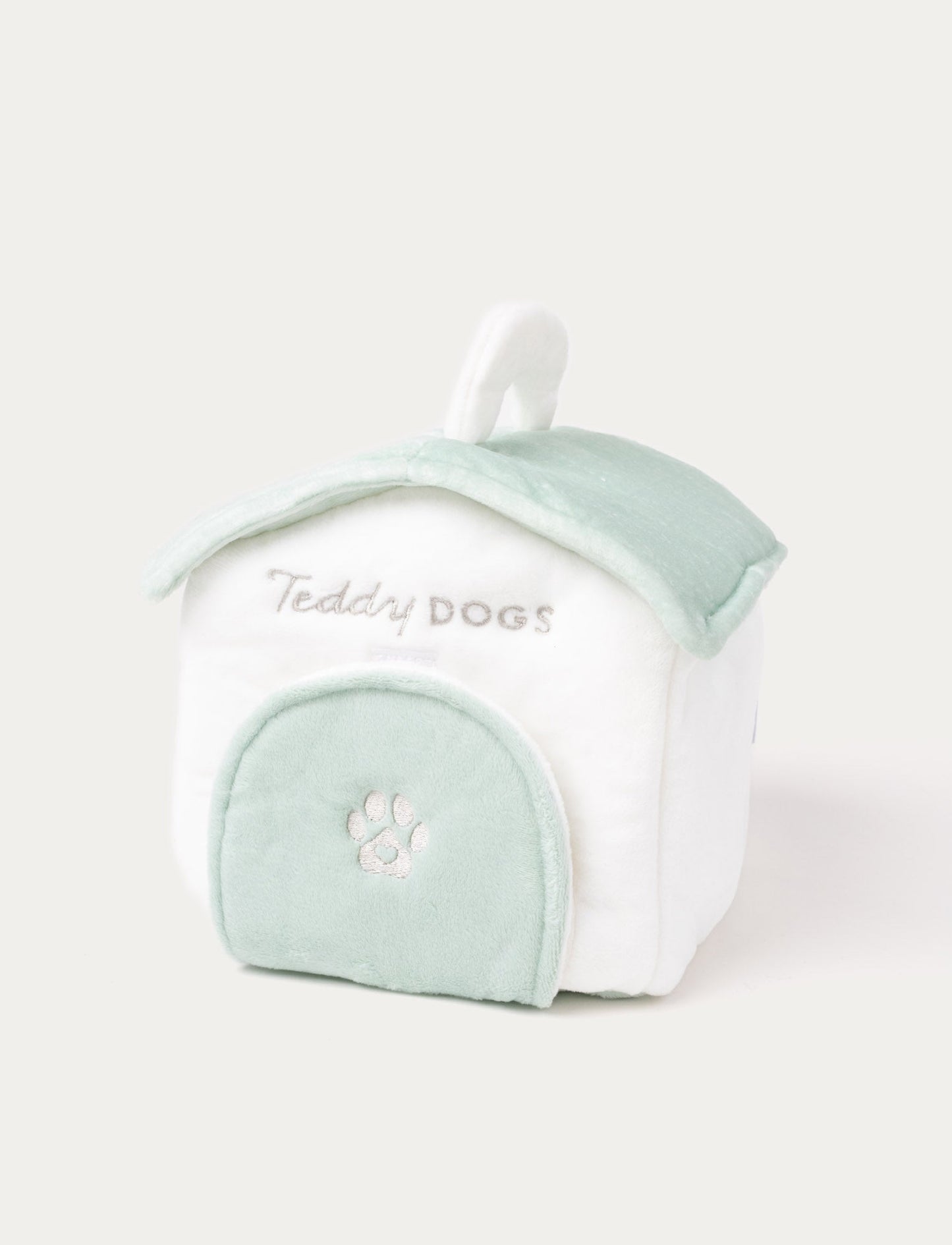 A plush dog with a doghouse, dog bone, water bowl, and ball, perfect for imaginative play.