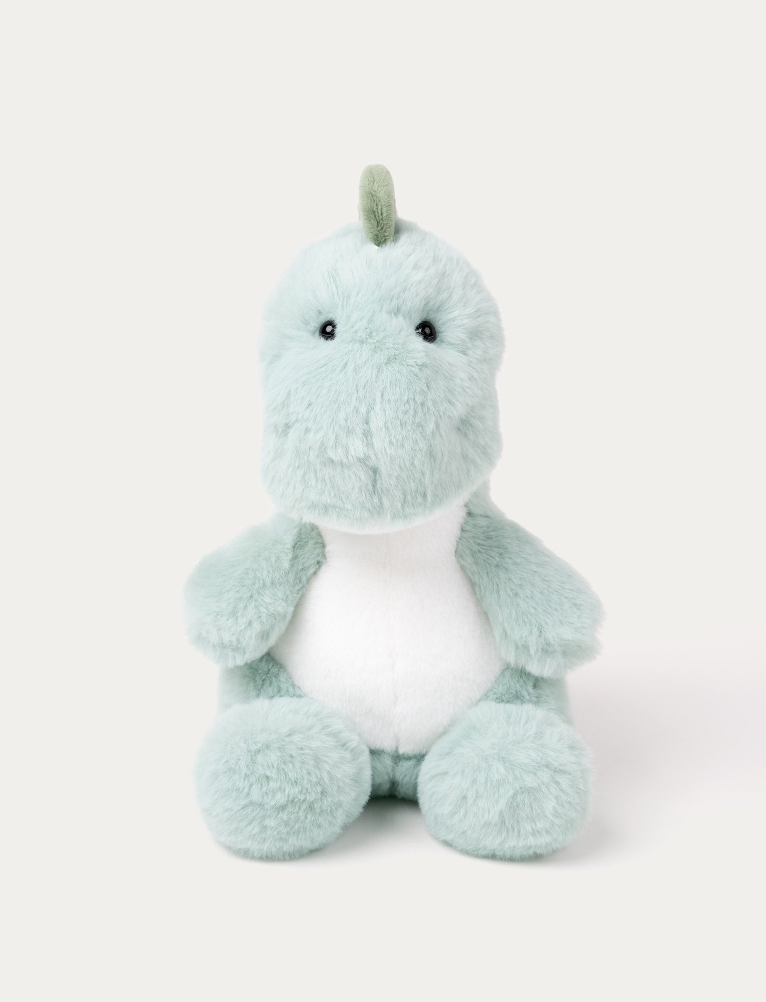  Image of A green plush dinosaur with soft fur, perfect for cuddles and adventures.