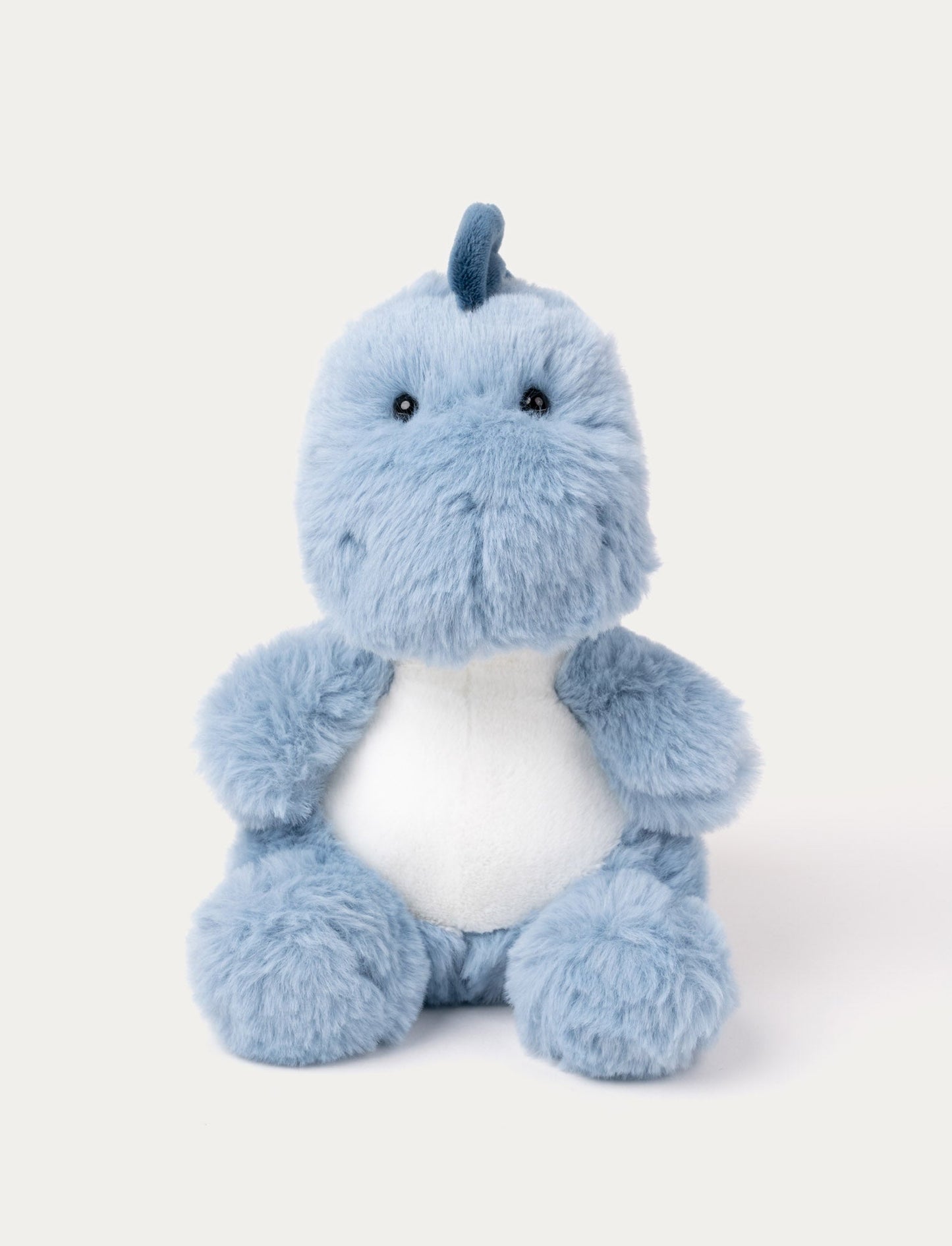 A blue plush dinosaur with soft fur, perfect for cuddles and adventures.