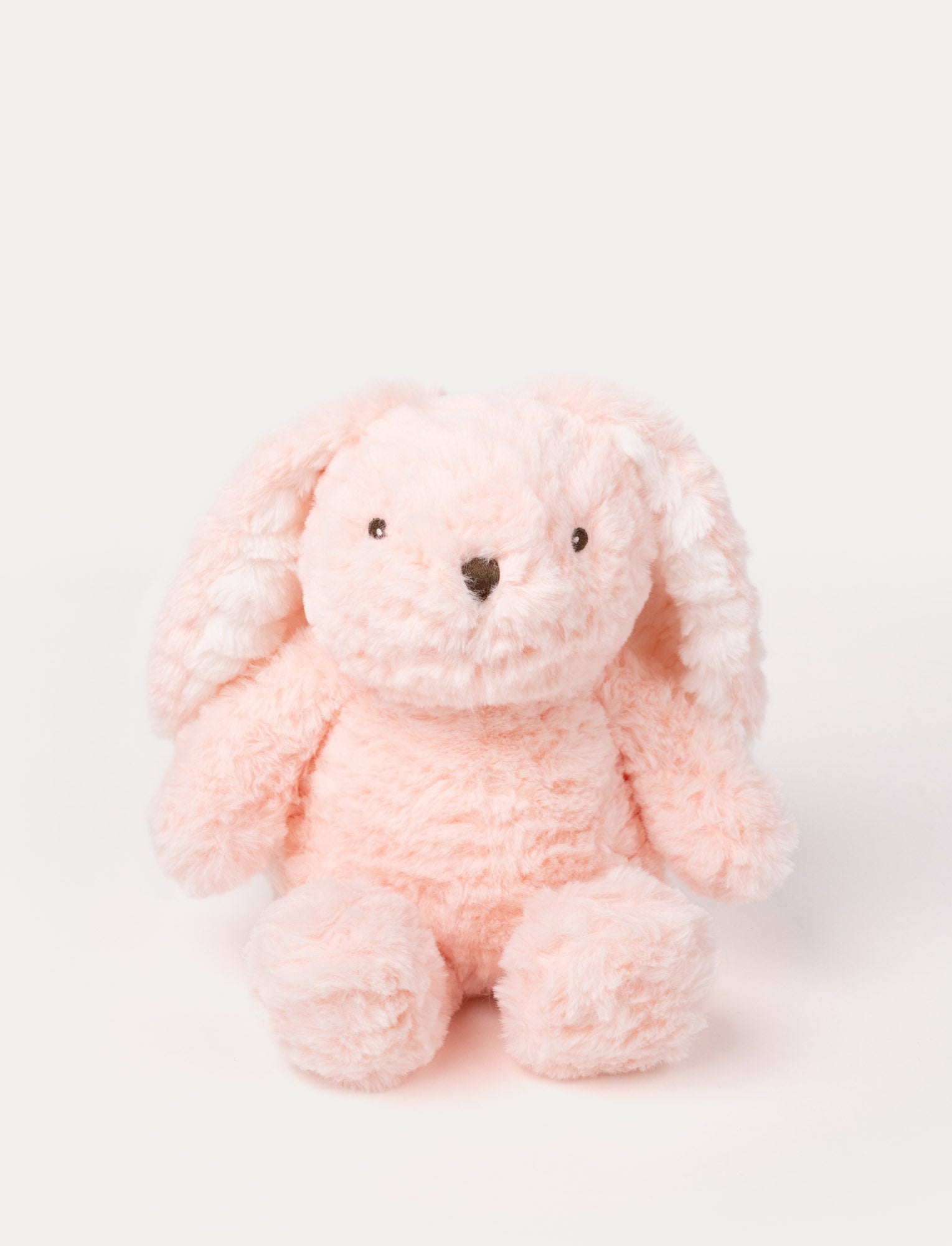  Image of Soft pink bunny plush with floppy ears, fluffy fur, and a stitched nose.