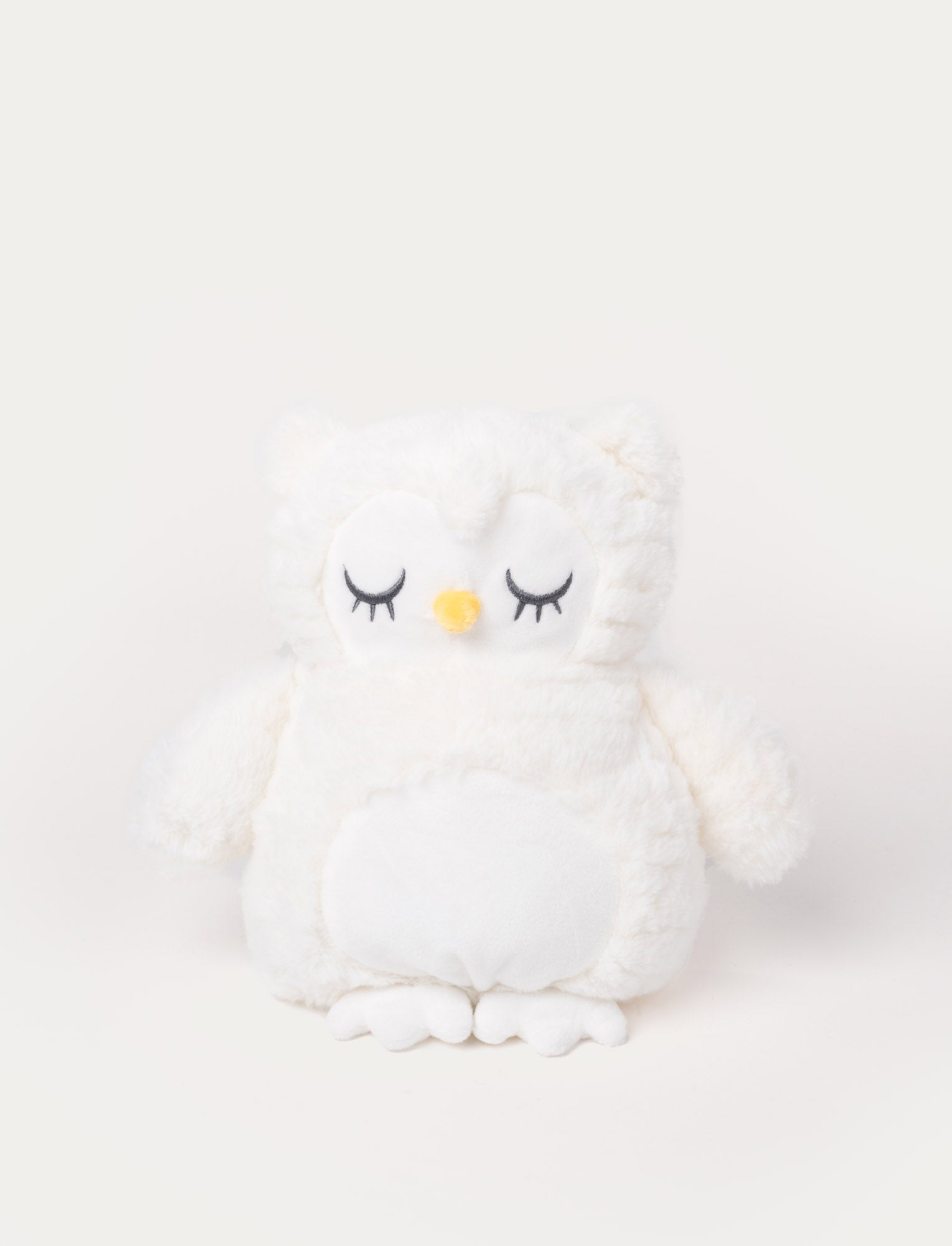  Image of Soft white owl plush with embroidered closed eyes, a yellow beak, and a fluffy round body.