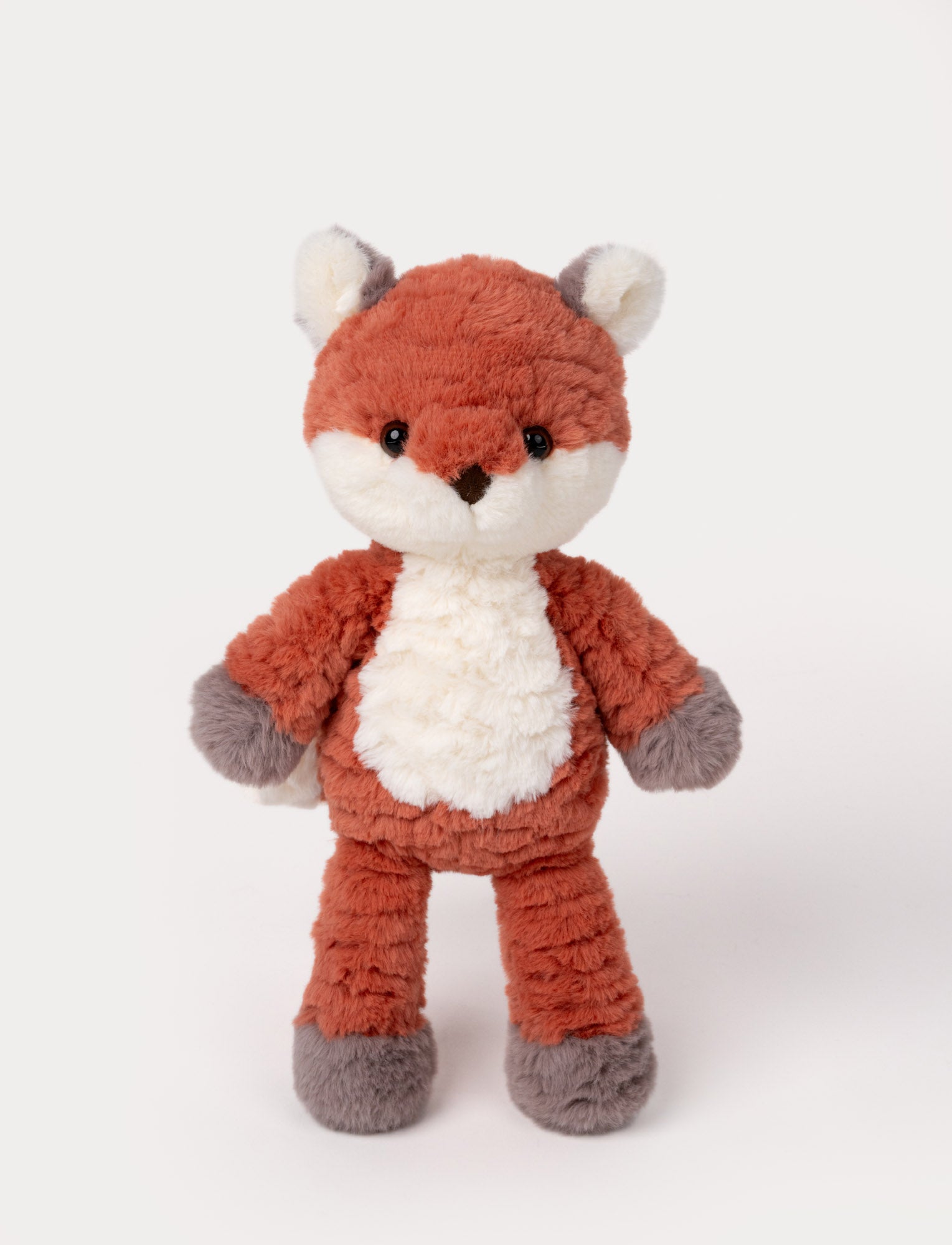  Image of Soft fox plush with a textured orange body, white belly, and gray accents on paws and ears.