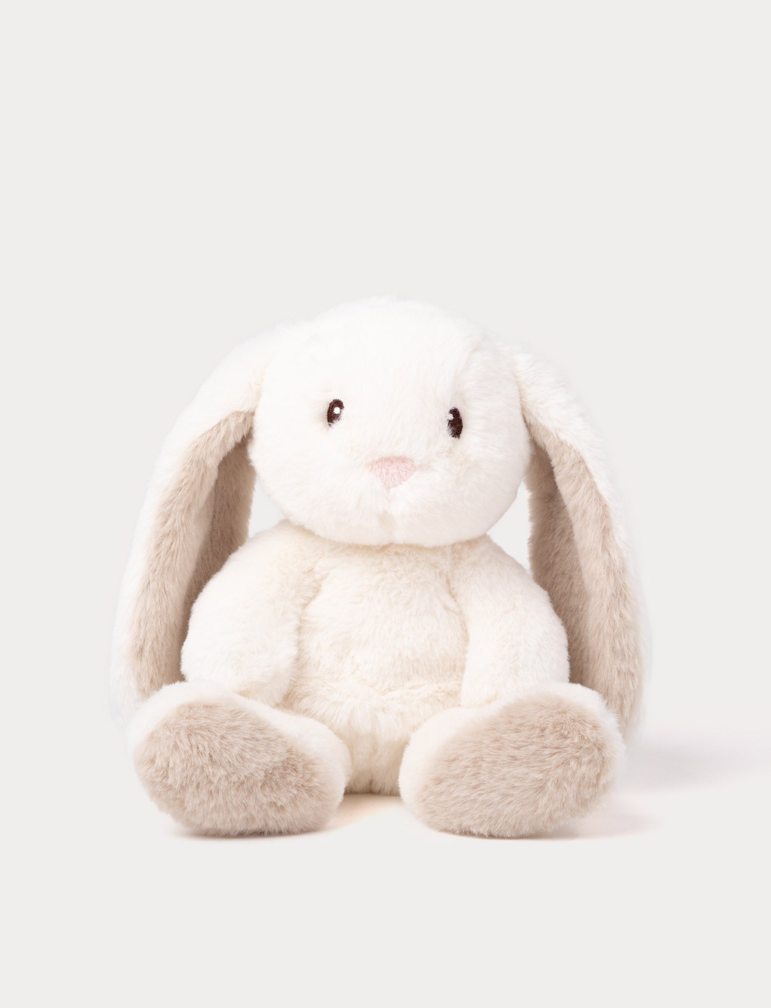  Image of A cream plush bunny with silky-soft fur, faux suede detail on its back, and embroidered eyes.