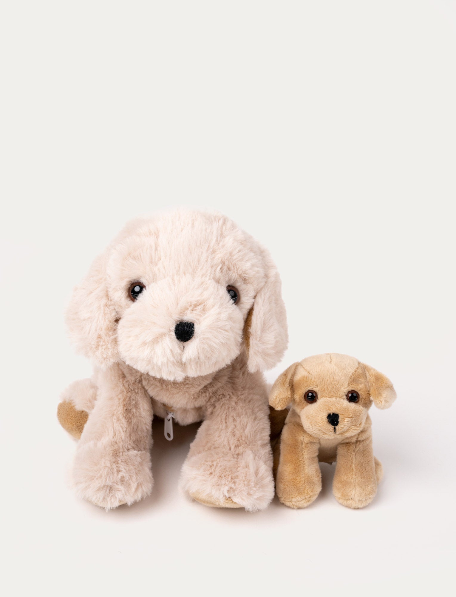  Image of A soft 2-in-1 toy featuring a mother dog and puppy that can be placed inside Tess's belly.