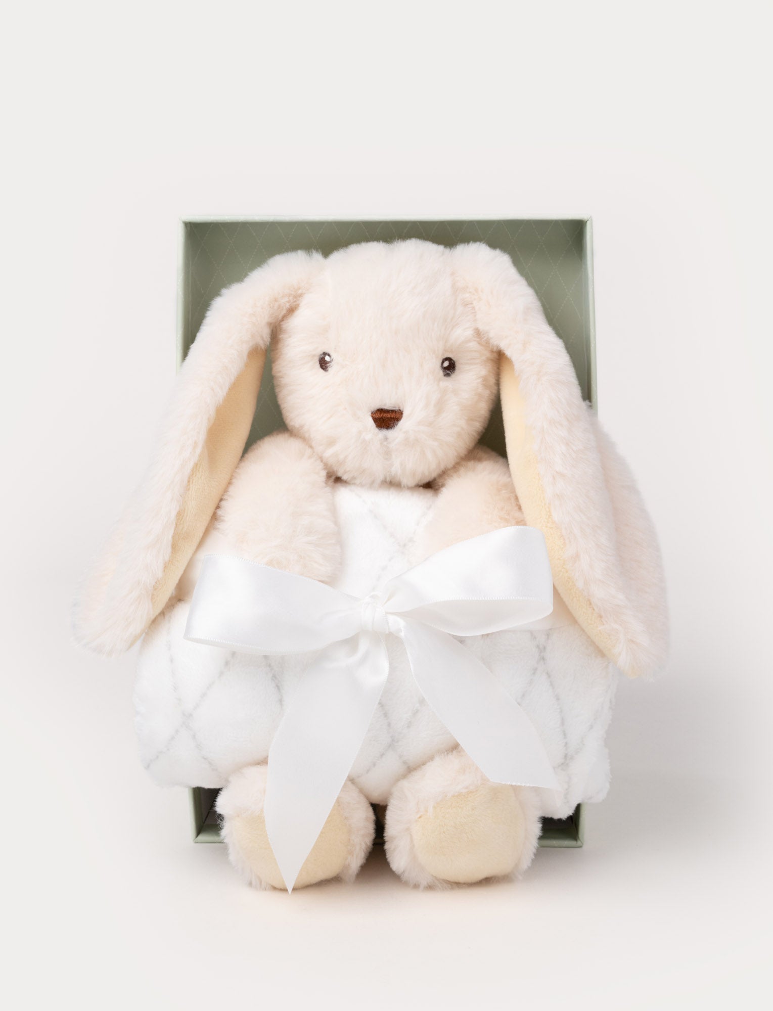  Image of Gift set with a cream-colored plush bunny holding a soft white blanket tied with a satin ribbon, presented in a green box.