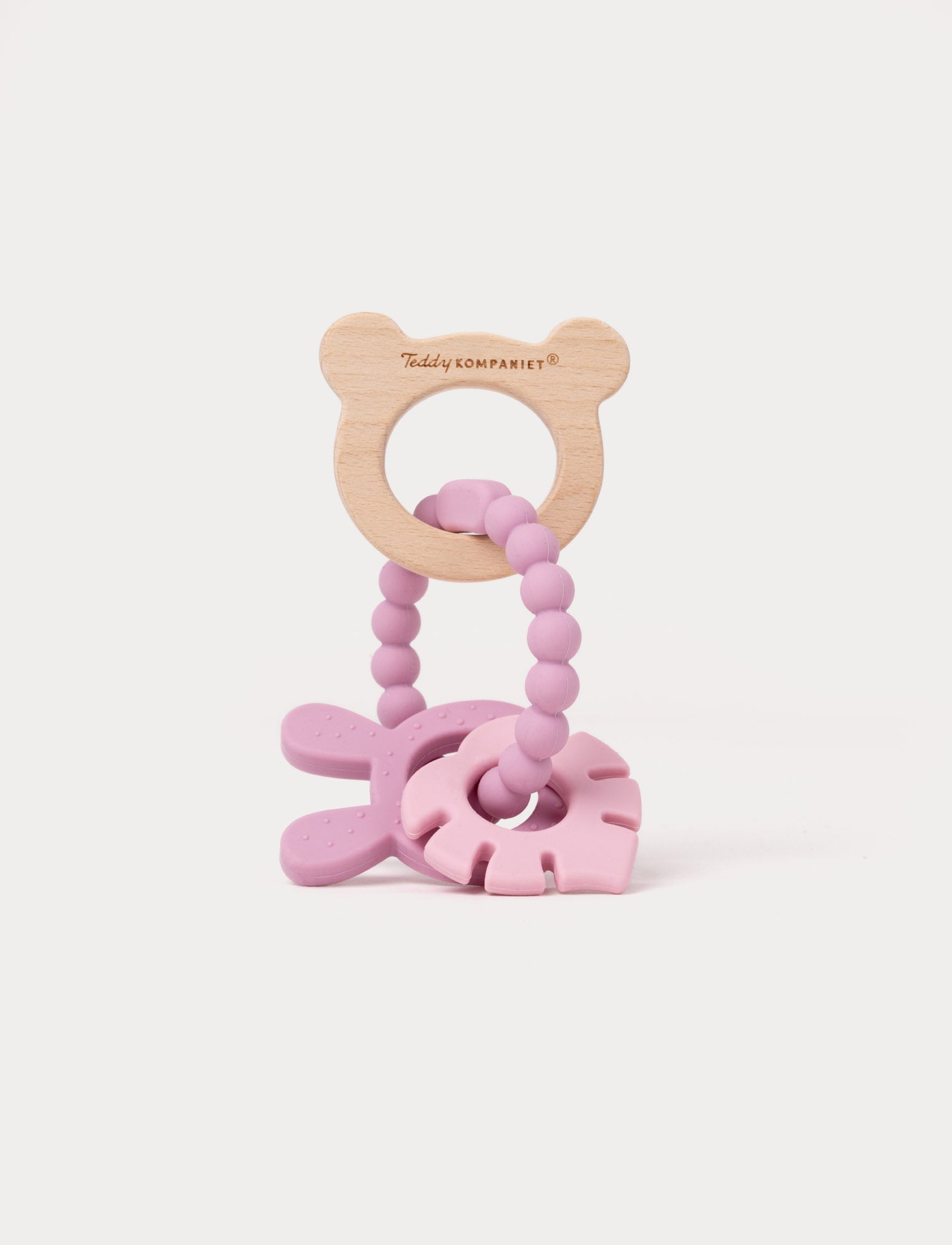  Image of Wooden and silicone baby teething toy in pink with a bear-shaped handle, beaded loop, and soft textured shapes.