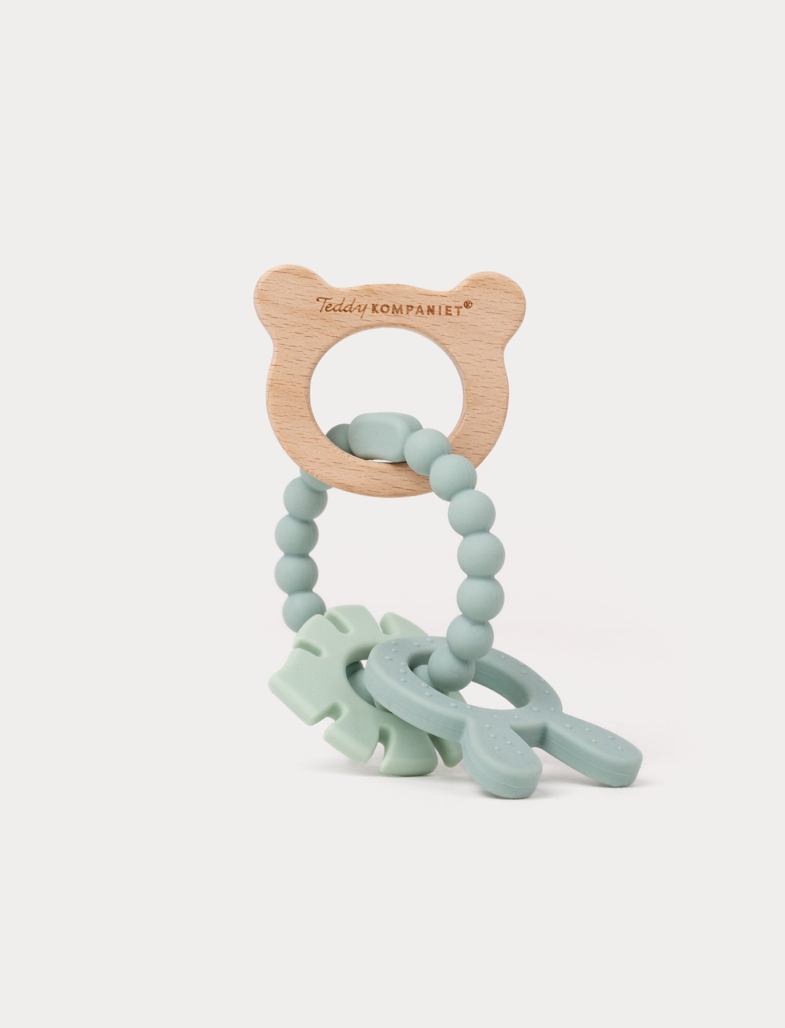  Image of Wooden and silicone baby teething toy in green with a bear-shaped handle, beaded loop, and soft textured shapes.
