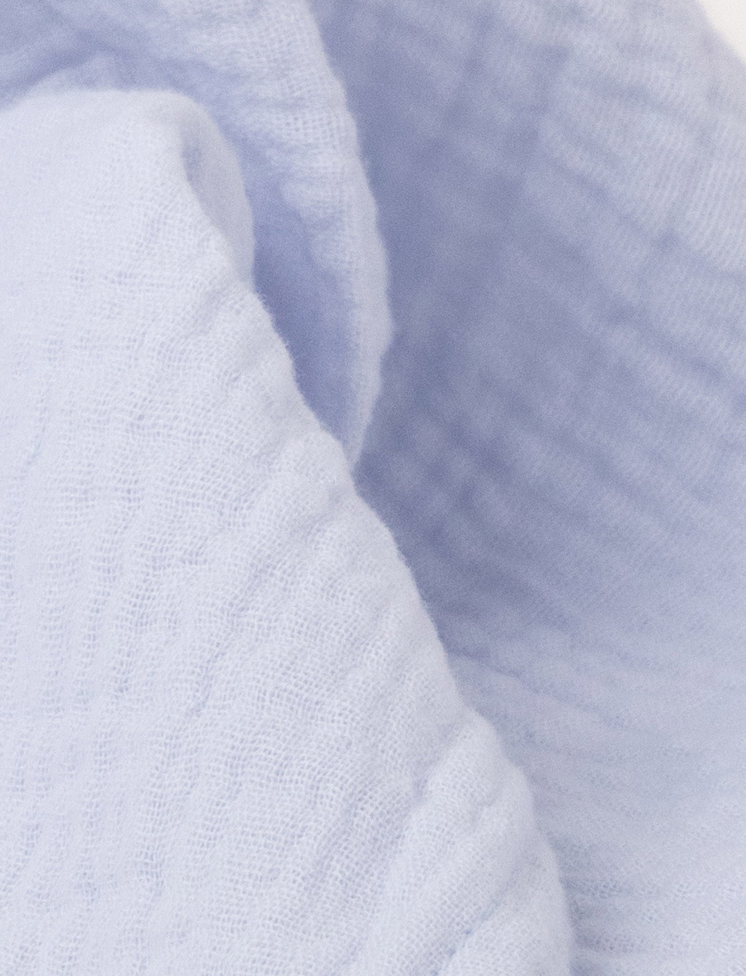  Image of Soft baby blanket with a plush light blue ,levander, bunny head, long floppy ears, and a small bow.