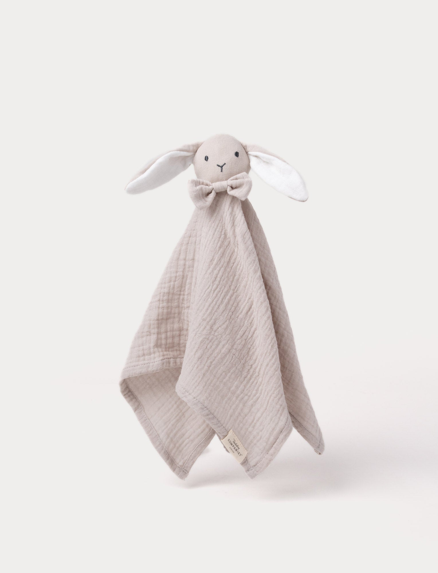  Image of Soft baby blanket with a plush beige bunny head, long floppy ears, and a small bow.