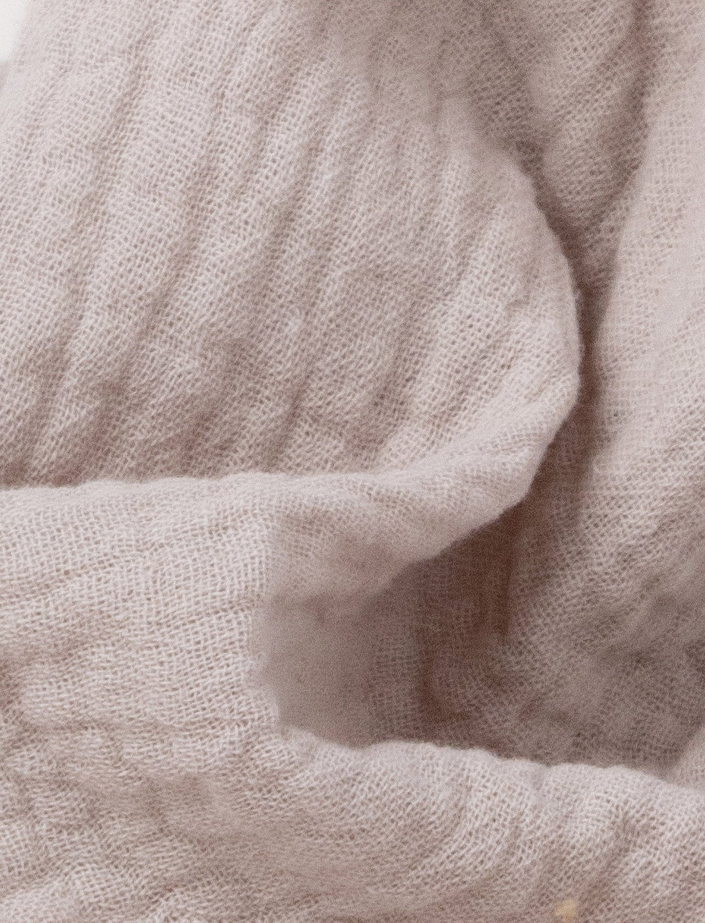 Soft baby blanket with a plush beige bunny head, long floppy ears, and a small bow.