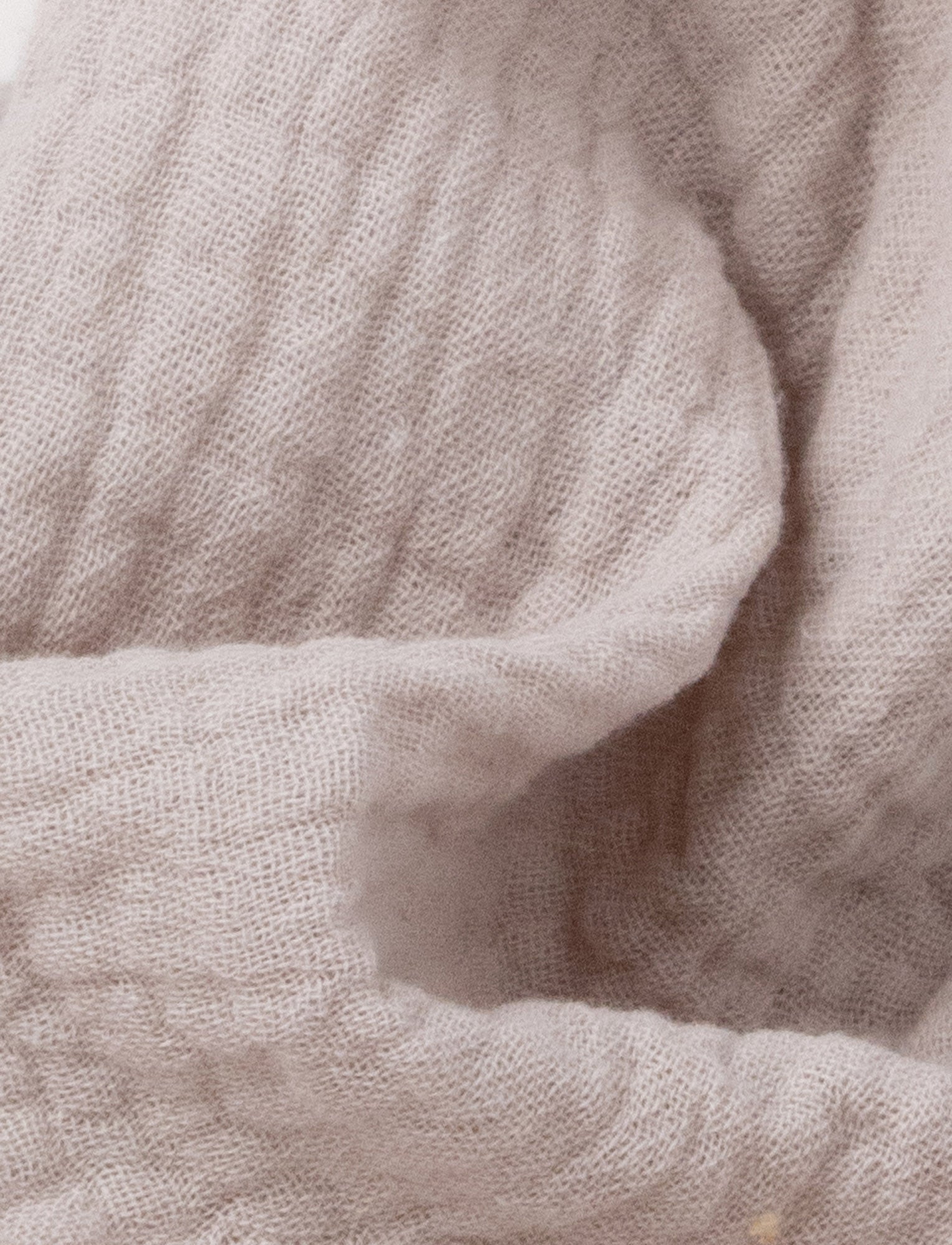  Image of Soft baby blanket with a plush beige bunny head, long floppy ears, and a small bow.