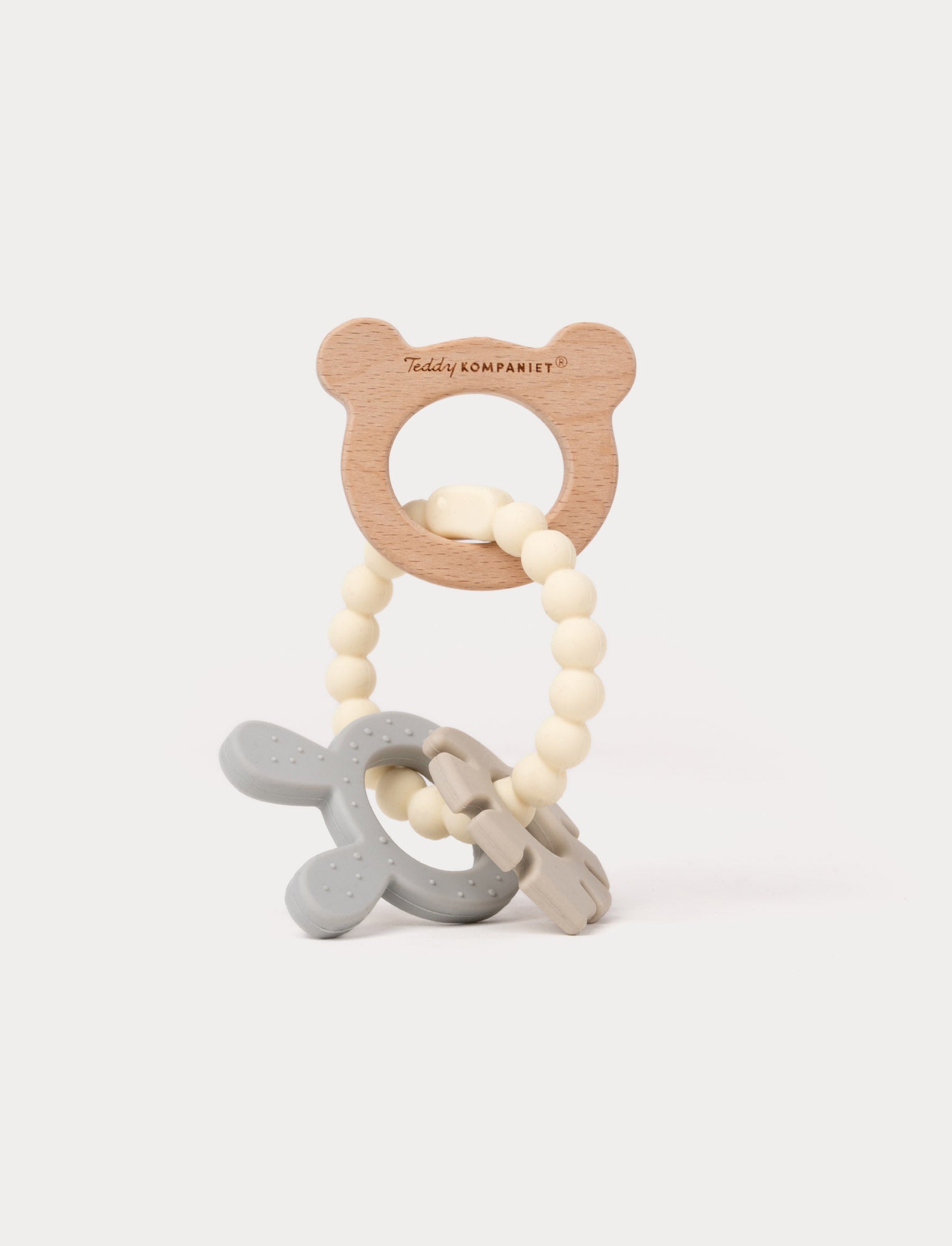  Image of Wooden and silicone baby teething toy with a bear-shaped handle, beaded loop, and soft textured shapes.