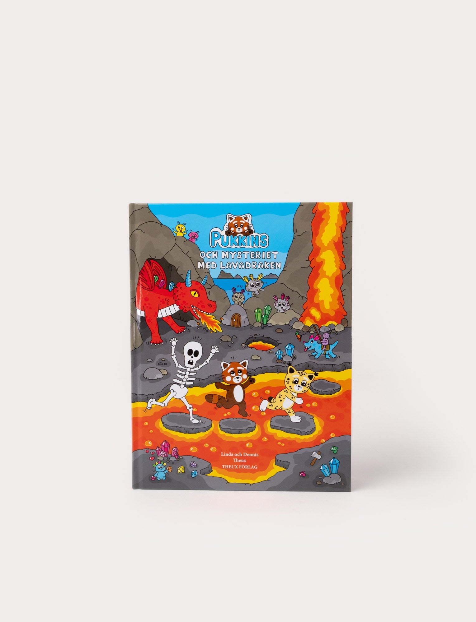  Image of Children's book with vibrant illustrations of Pukkins and friends exploring the Land of Lava, featuring mysterious stone creatures and a Lava Dragon.
