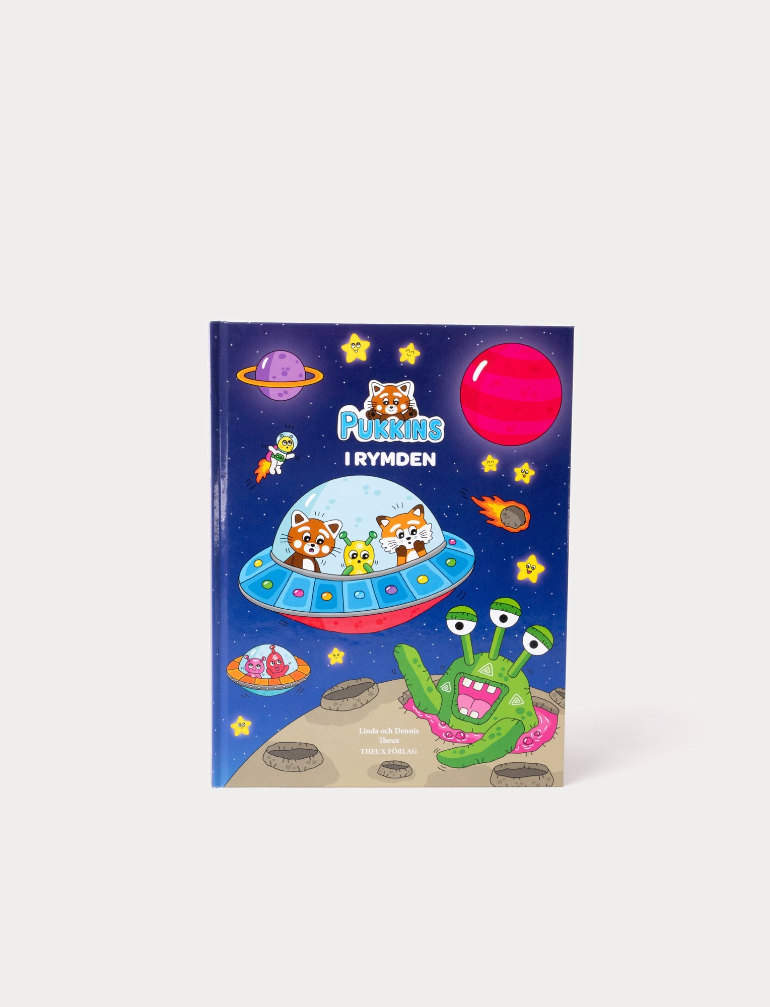  Image of Children's book with vibrant illustrations of Pukkins and friends in space, featuring a spaceship and cosmic adventure scenes.