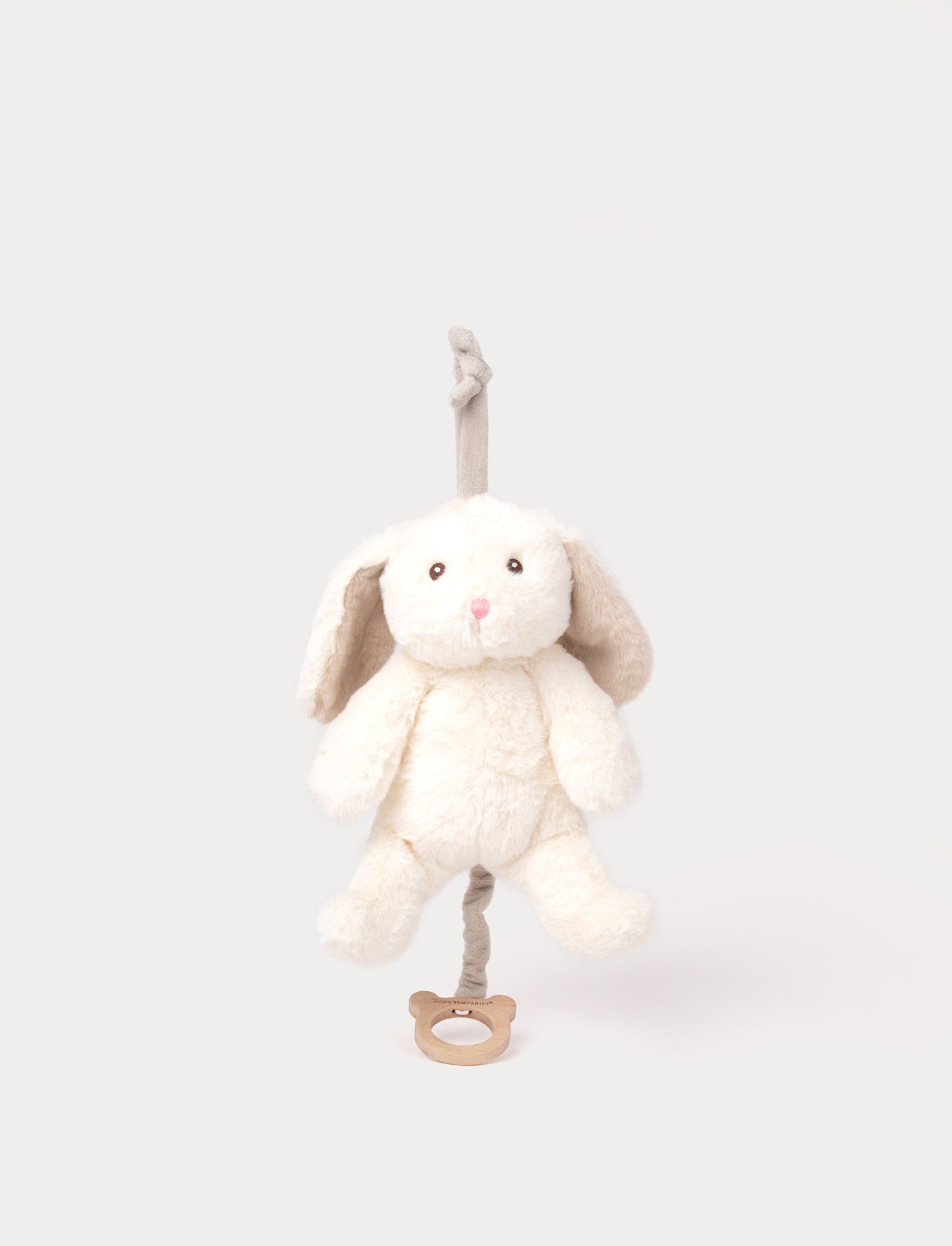  Image of Soft white bunny musical plush with floppy beige ears, a pull-string, and a loop for hanging.