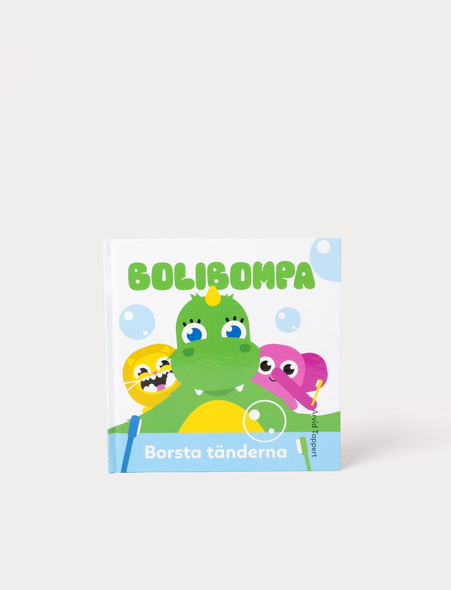 Colorful picture book with Bolibompa Dragon, featuring vibrant illustrations of tooth brushing and playful characters.