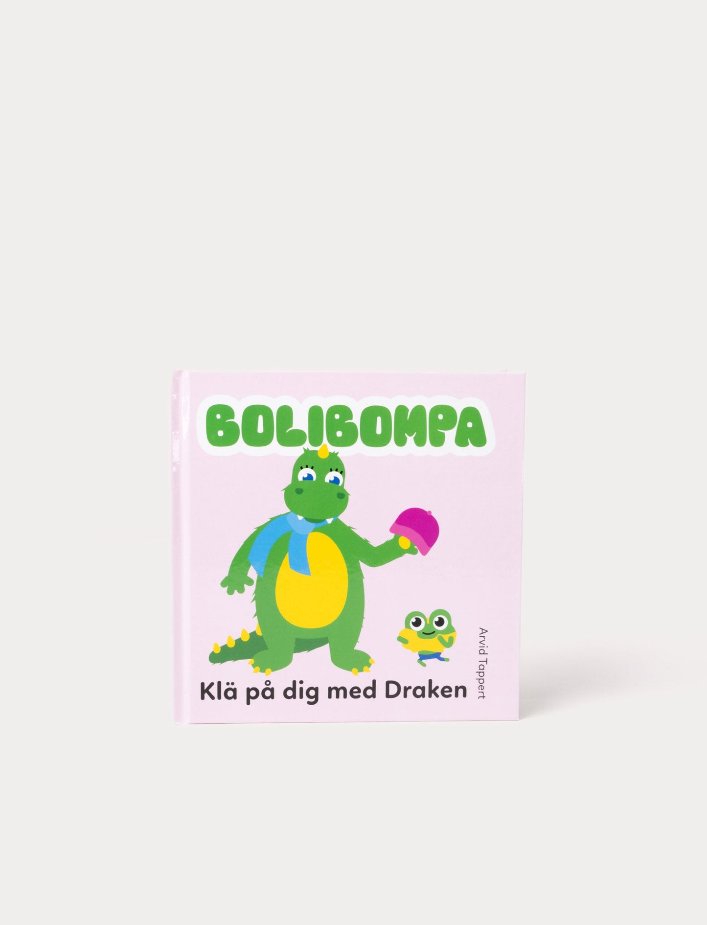 Colorful picture book with Bolibompa Dragon, featuring vibrant illustrations of different clothing items and a playful dressing adventure.